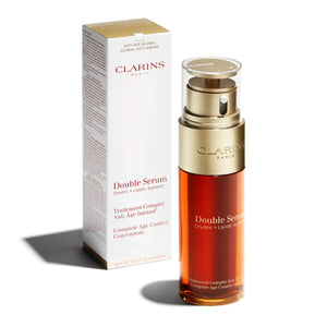 Clarins Double Serum wholesale lot with anti-age complete age control concentrate in gold and amber bottle next to box