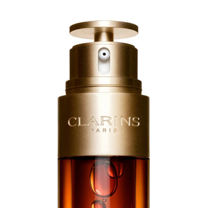 Clarins Double Serum wholesale lot with gold pump dispenser and amber bottle from Think AtoZ Ltd