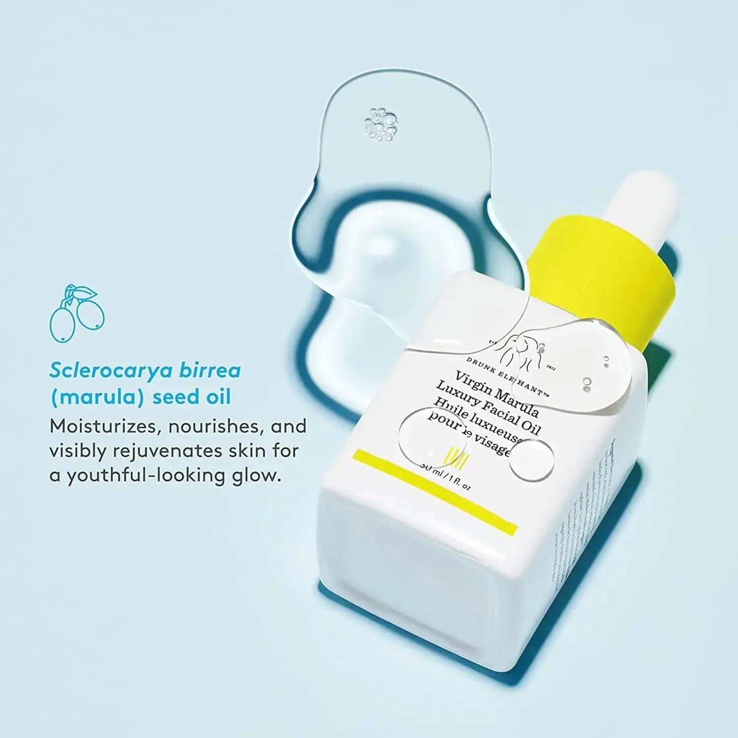 Drunk Elephant Virgin Marula Oil wholesale bottle with yellow dropper on blue background for moisturizing skin