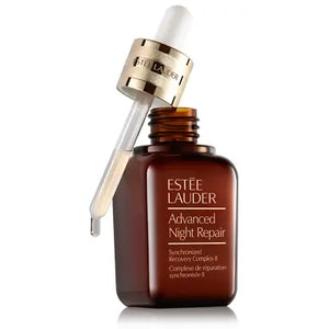 Estee Lauder Advanced Night Repair serum bottle with dropper and golden cap by Think AtoZ Ltd