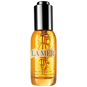 La Mer The Renewal Oil wholesale amber bottle with black cap and visible bubbles inside