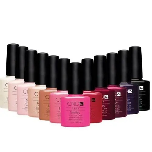 CND Shellac gel nail polish collection in various pink, red, purple, and neutral shades with black caps