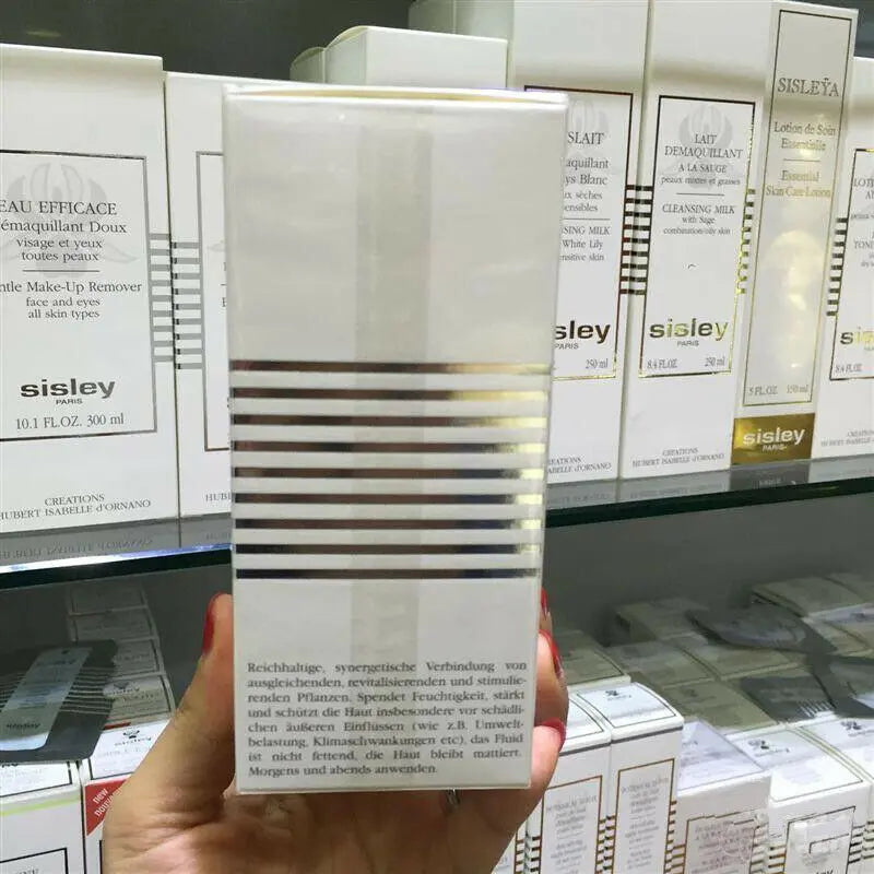 ThinkAtoZ Sisley Ecological Compound day night cream packaging held in hand with skincare products on store shelf