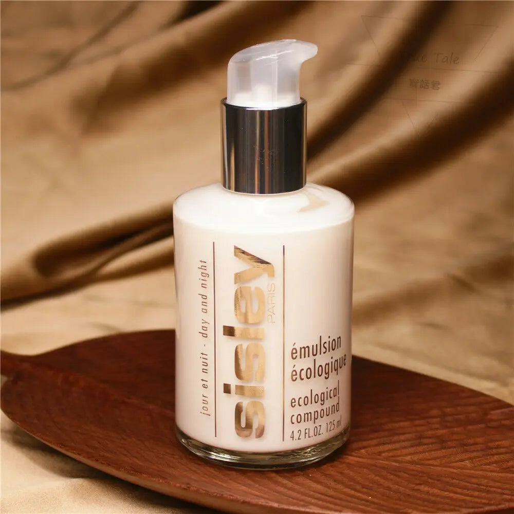 Sisley Ecological Compound day night cream bottle with pump dispenser on a wooden tray