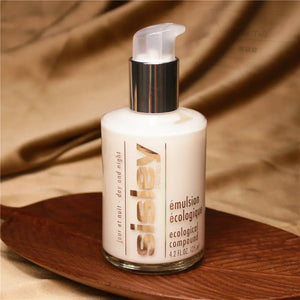 Sisley Ecological Compound day night cream bottle with pump dispenser on a wooden tray