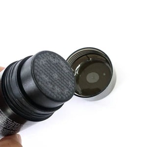 Toppik hair building fiber powder container with sifter and open black lid for easy application